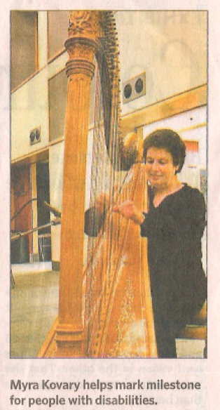 Myra Kovary playing harp at United Nations celebration