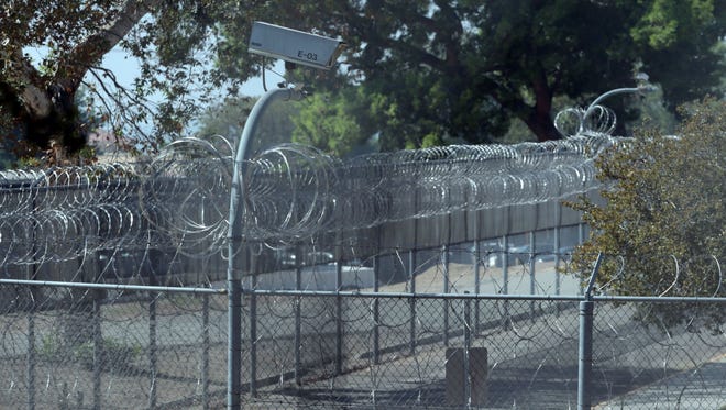 exercise yard of Patton Hospital with barbed wire and high security