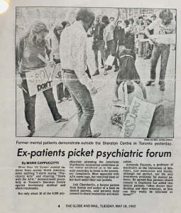 This image is a picture taken at the OHSU exhibit. It is an older, slightly stained newspaper published by the Globe and Mail. In the newspaper clipping, there is a featured photograph of individuals protesting against the APA. Men and women are gathered and smiling, holding signage. The newspaper's text below the picture describes how only 30 of the 9,000 psychiatrists came out from their conference at the APA to converse with protesters.