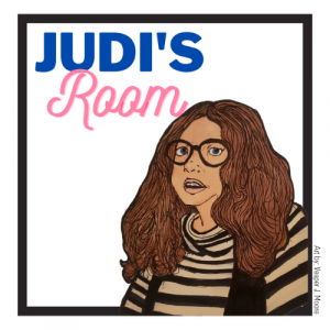 Image is a rendition of Judi Chamberlin by Vesper Moore. In this portrait, Judi has olive toned skin, long curly brown hair and large reading glasses. She is wearing a striped turtleneck